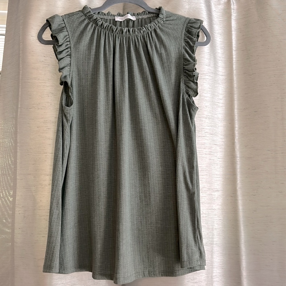 Ces femme top. Pretty green color. Never worn.